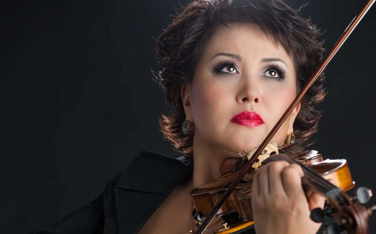 La stella kazaka del violino a Tolmezzo & Cjants d'Incjaroi a Paularo -