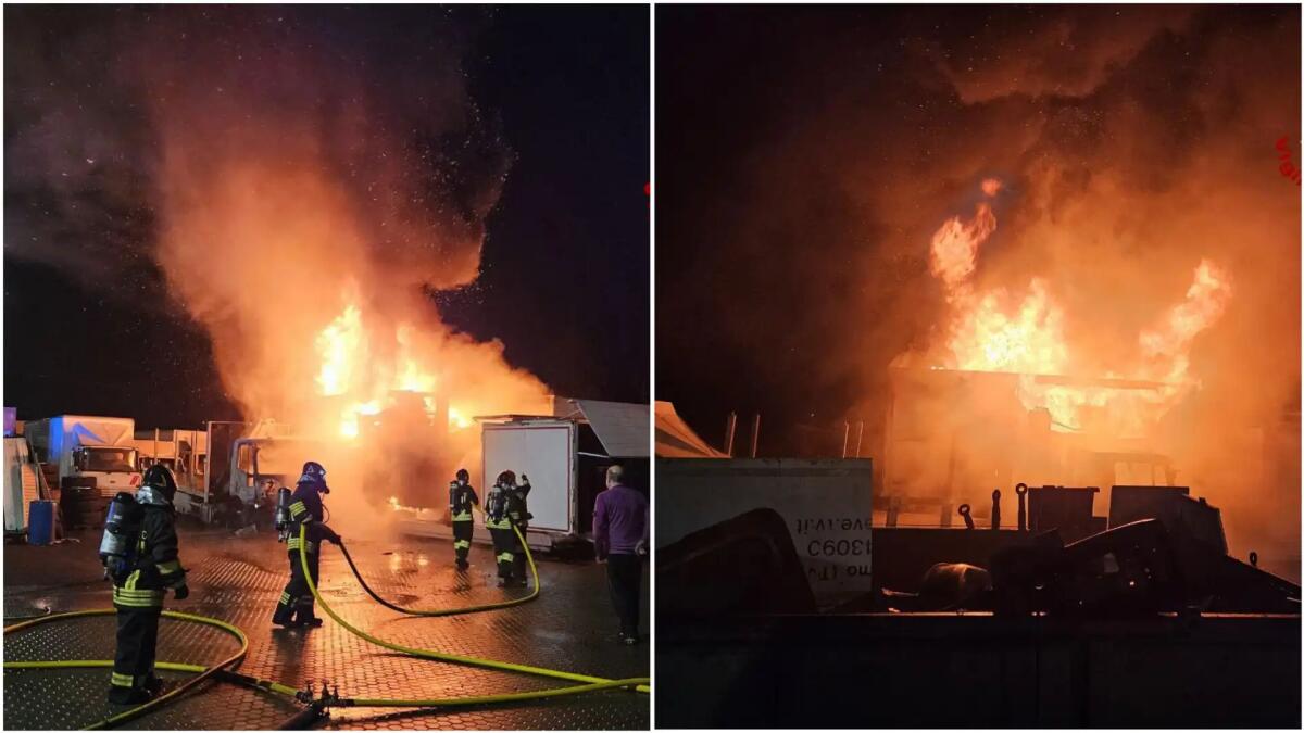 Incendio in concessionaria nella notte, in fiamme tre mezzi pesanti e un rimorchio - 