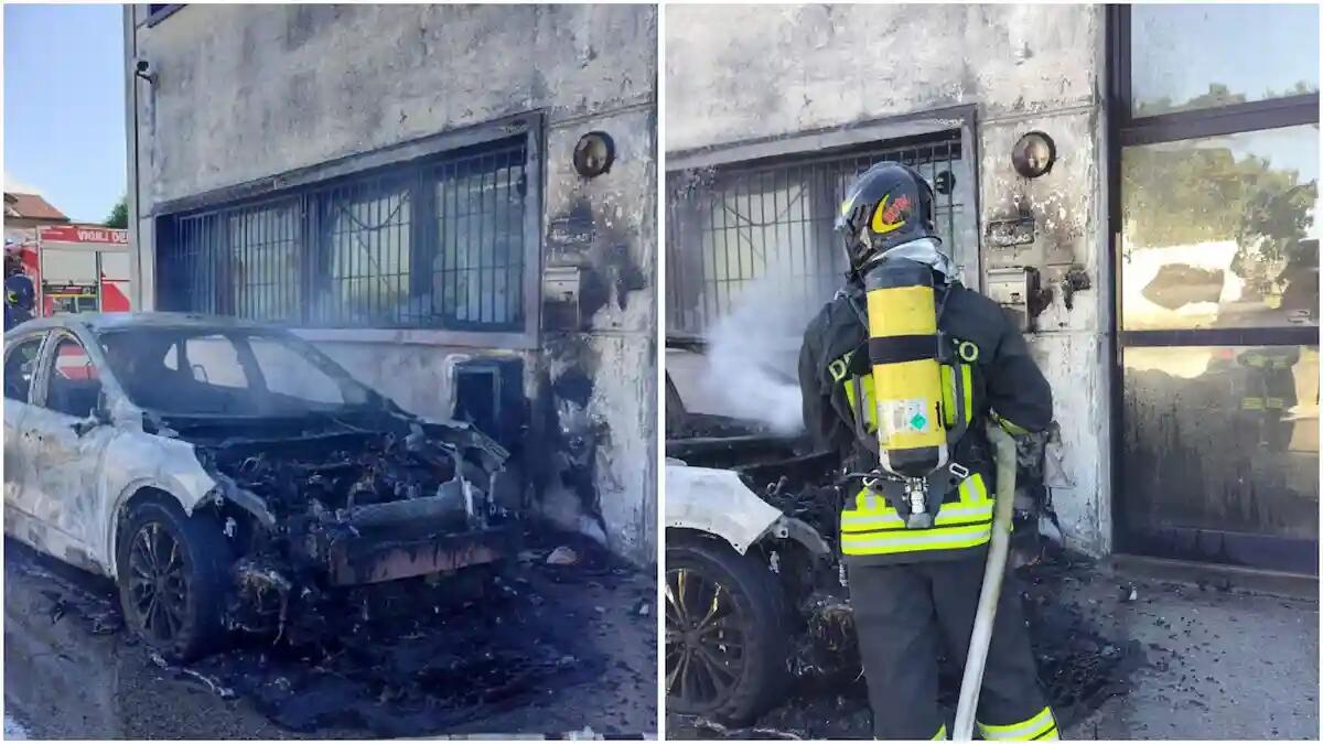Auto ibrida in fiamme, danneggiata la facciata e le vetrate dell'edificio adiacente: indagini in corso -